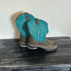 Ariat cowboy boots. Goes up 1/2 my calves